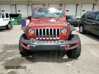 2009 Jeep Wrangler X z VIN 1J4FA24139L740959, wystawiony jako Copart lot #56509075 z przebiegiem 121 927 mil mil oraz Szkoda całkowita • Salvage title. Historia ofert i sprzedaży dostępna na DreamBid. Obrazek 13.