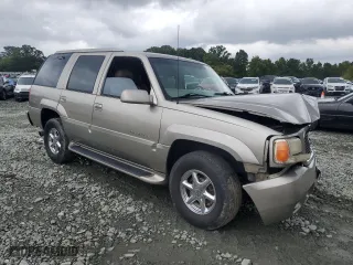 2000 Cadillac Escalade with VIN 1GYEK13R5YR112858, listed as a Copart auction lot 71651294 with 228,689 mi miles and Salvage Title. Bid and sale history available at carsss.com. Image 4.