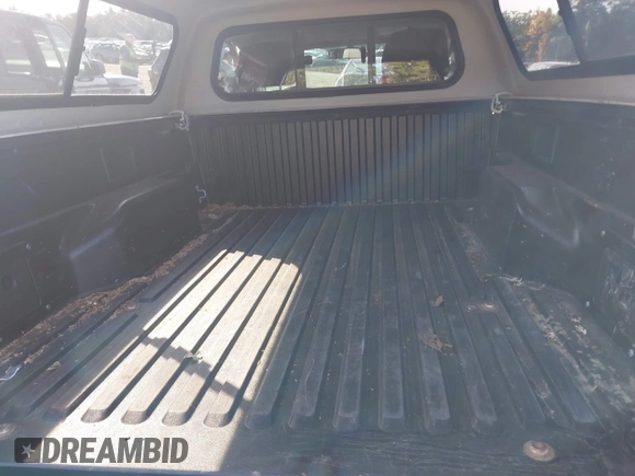 2012 Toyota Tacoma with VIN 5TFPX4ENXCX009676, listed as a IAAI auction lot 40458050 with 101,908 mi miles and . Bid and sale history available at DreamBid. Image 8.