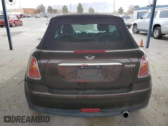 2010 MINI Convertible with VIN WMWMR3C50ATU97547, listed as a Copart auction lot 44780185 with 91,194 mi miles and Salvage Title. Bid and sale history available at DreamBid. Image 6.