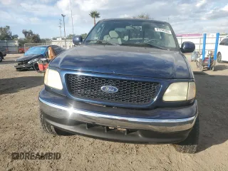 2003 Ford F-150 XL with VIN 1FTRX17L13NA95202, listed as a Copart auction lot 87766385 with 124,961 mi miles and Salvage Title. Bid and sale history available at carsss.com. Image 5.