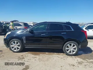 2014 Cadillac SRX Performance Collection z VIN 3GYFNCE35ES517868, wystawiony jako IAAI lot #41775522 z przebiegiem 166 960 mil mil oraz . Historia ofert i sprzedaży dostępna na DreamBid. Obrazek 14.