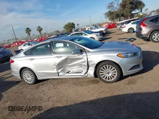 2014 Ford Fusion SE Hybrid with VIN 3FA6P0LU4ER206343, listed as a IAAI auction lot 41600260 with 198,834 mi miles and . Bid and sale history available at DreamBid. Image 13.