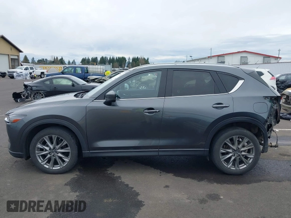 2020 Mazda CX-5 Grand Touring with VIN JM3KFBDM4L0829861, listed as a IAAI auction lot 41826250 with 62,091 mi miles and . Bid and sale history available at carsss.com. Image 15.