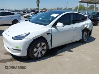 2023 Tesla Model Y Long Range z VIN 7SAYGDEE5PA104635, wystawiony jako IAAI lot #41989014 z przebiegiem 15 347 mil mil oraz . Historia ofert i sprzedaży dostępna na DreamBid. Obrazek 2.