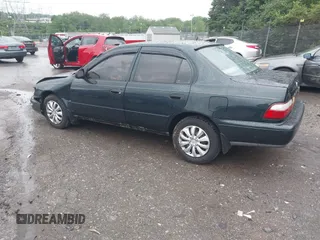 1997 Toyota Corolla with VIN 2T1BA02E2VC211034, listed as a IAAI auction lot 42253359 with 201,451 mi miles and . Bid and sale history available at DreamBid. Image 3.