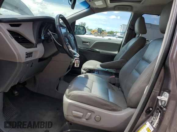 2015 Toyota Sienna XLE with VIN 5TDYK3DCXFS668851, listed as a Copart auction lot 60452005 with 205,549 mi miles and Salvage title. Bid and sale history available at DreamBid. Image 7.