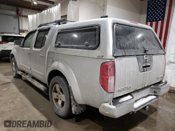 2006 Nissan Frontier LE with VIN 1N6AD07W96C436210, listed as a Copart auction lot 87704505 with 119,485 mi miles and Salvage title. Bid and sale history available at DreamBid. Image 2.