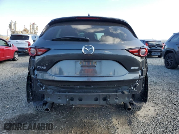 2018 Mazda CX-5 Grand Touring with VIN JM3KFADM8J1330353, listed as a Copart auction lot 54752325 with 96,577 mi miles and Salvage Title. Bid and sale history available at DreamBid. Image 6.