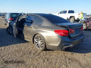 2019 BMW 5 Series M550i xDrive with VIN WBAJB9C50KB464159, listed as a IAAI auction lot 41758879 with 9,000 mi miles and . Bid and sale history available at DreamBid. Image 3.