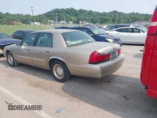 2000 Mercury Grand Marquis LS z VIN 2MEFM75W7YX729323, wystawiony jako IAAI lot #42475457 z przebiegiem 148 910 mil mil oraz . Historia ofert i sprzedaży dostępna na DreamBid. Obrazek 3.