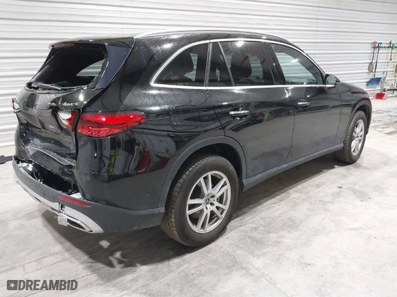 2023 Mercedes-Benz GLC with VIN W1NKM4HB1PU020439, listed as a IAAI auction lot 41676723 with 25,609 mi miles. Bid and sale history available at carsss.com. Image 4.