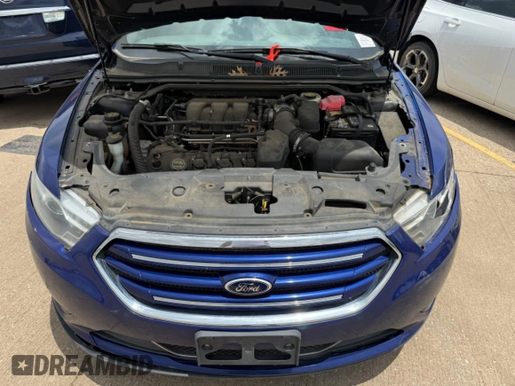 2014 Ford Taurus Limited with VIN 1FAHP2F84EG141388, listed as a Copart auction lot 61052645 with 112,876 mi miles and Clean title. Bid and sale history available at DreamBid. Image 7.