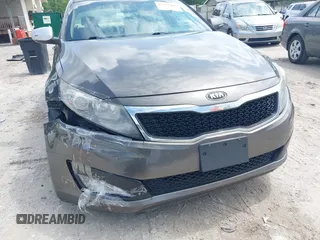 2013 Kia Optima EX z VIN 5XXGN4A77DG251606, wystawiony jako IAAI lot #42377401 z przebiegiem 135 067 mil mil oraz . Historia ofert i sprzedaży dostępna na DreamBid. Obrazek 13.