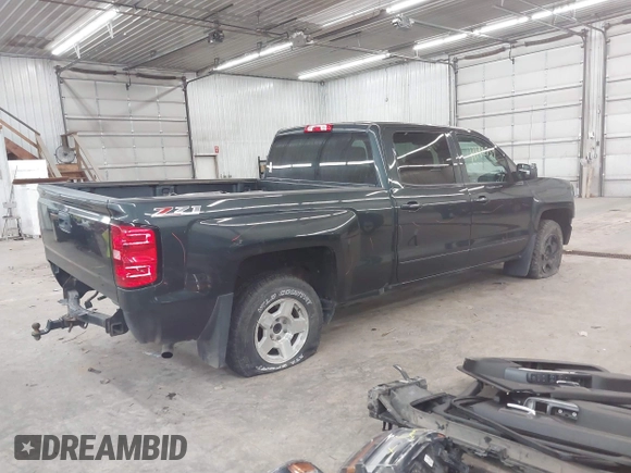 2017 Chevrolet Silverado 1500 LT with VIN 1GCUKREC0HF132896, listed as a IAAI auction lot 41192759 with 182,832 mi miles and . Bid and sale history available at DreamBid. Image 4.