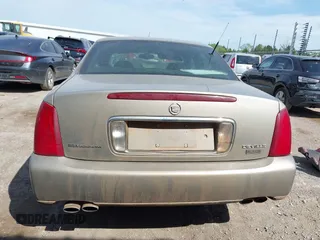 2003 Cadillac DeVille z VIN 1G6KD54Y23U115516, wystawiony jako IAAI lot #42053767 z przebiegiem 132 466 mil mil oraz . Historia ofert i sprzedaży dostępna na DreamBid. Obrazek 16.