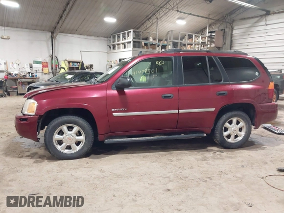2006 GMC Envoy SLT with VIN 1GKDS13S362135683, listed as a IAAI auction lot 41477501 with 214,760 mi miles. Bid and sale history available at carsss.com. Image 14.