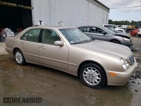 2001 Mercedes-Benz E-Class with VIN WDBJF65J01B389296, listed as a Copart auction lot 71933404 with 124,392 mi miles and Salvage Title. Bid and sale history available at carsss.com. Image 4.