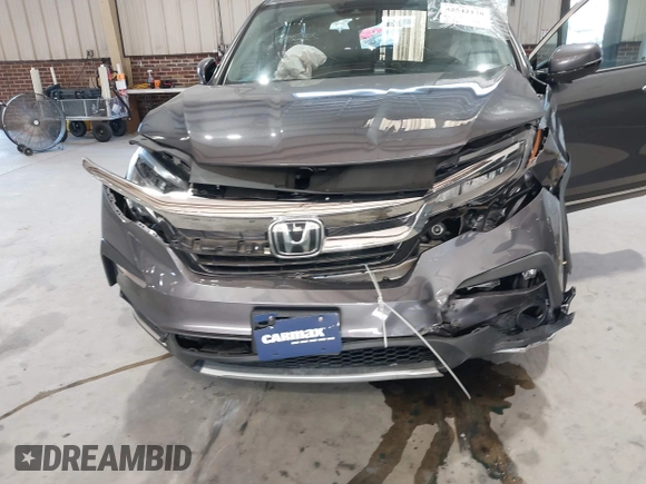 2021 Honda Pilot Touring 8-Passenger with VIN 5FNYF6H95MB048527, listed as a IAAI auction lot 42542138 with 40,584 mi miles and . Bid and sale history available at DreamBid. Image 6.
