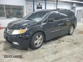 2012 Honda Odyssey Touring with VIN 5FNRL5H91CB118692, listed as a Copart auction lot 57651245 with 150,614 mi miles and Salvage title. Bid and sale history available at DreamBid. Image 1.