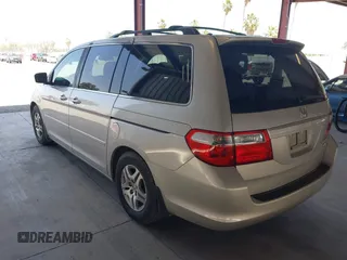2005 Honda Odyssey EX-L with VIN 5FNRL38705B106488, listed as a IAAI auction lot 42545141 with 199,619 mi miles and . Bid and sale history available at DreamBid. Image 3.