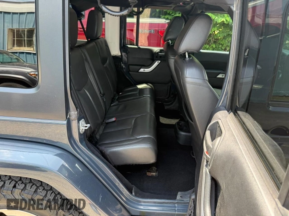 2016 Jeep Wrangler Unlimited Sahara with VIN 1C4BJWEG9GL169490, listed as a Copart auction lot 61507025 with 198,602 mi miles and Clean title. Bid and sale history available at DreamBid. Image 6.