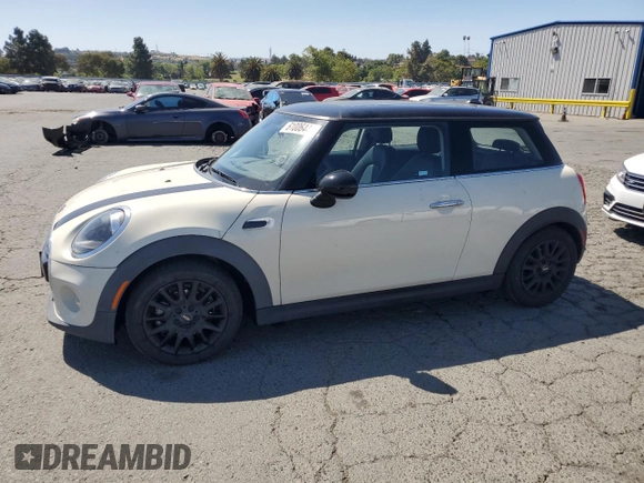 2019 MINI Hardtop Cooper z VIN WMWXP5C52K2H29767, wystawiony jako Copart lot #61006445 z przebiegiem 50 212 mil mil oraz Szkoda całkowita • Salvage title. Historia ofert i sprzedaży dostępna na DreamBid. Obrazek 1.