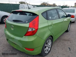 2013 Hyundai Accent SE with VIN KMHCU5AEXDU069586, listed as a IAAI auction lot 40968974 with 98,939 mi miles. Bid and sale history available at carsss.com. Image 4.