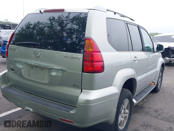 2004 Lexus GX 470 with VIN JTJBT20XX40032417, listed as a IAAI auction lot 42150885 with 180,568 mi miles. Bid and sale history available at carsss.com. Image 4.