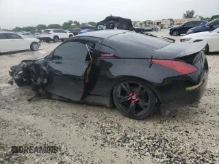 2004 Nissan 350Z Touring with VIN JN1AZ34D04T160475, listed as a Copart auction lot 59435035 with 122,875 mi miles and Salvage title. Bid and sale history available at DreamBid. Image 2.