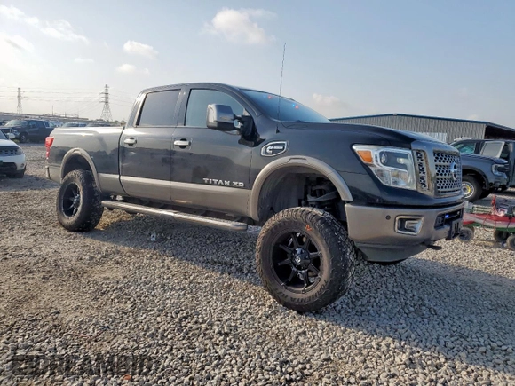 2017 Nissan Titan Platinum Reserve with VIN 1N6BA1F43HN568650, listed as a Copart auction lot 59593525 with 126,193 mi miles and Salvage title. Bid and sale history available at DreamBid. Image 4.