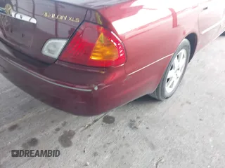 2000 Toyota Avalon XL z VIN 4T1BF28B7YU005222, wystawiony jako IAAI lot #42310903 z przebiegiem 118 700 mil mil oraz . Historia ofert i sprzedaży dostępna na DreamBid. Obrazek 13.