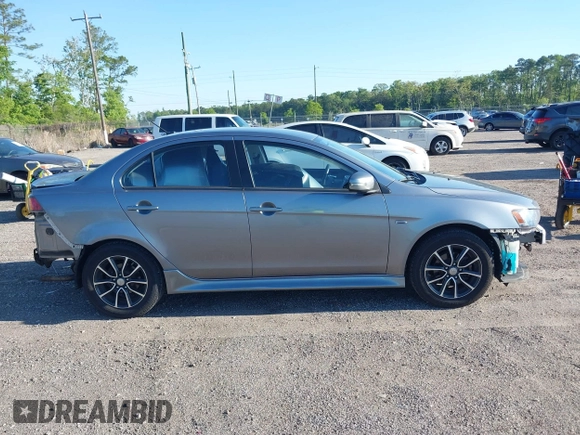 2015 Mitsubishi Lancer SE with VIN JA32V2FWXFU023626, listed as a IAAI auction lot 42012381 with 143,981 mi miles. Bid and sale history available at carsss.com. Image 13.