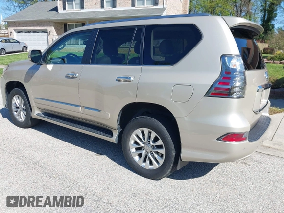 2014 Lexus GX with VIN JTJBM7FX7E5068037, listed as a IAAI auction lot 42069809 with 120,791 mi miles. Bid and sale history available at carsss.com. Image 3.