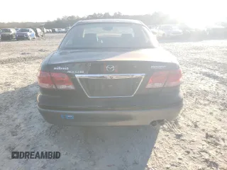 2002 Mazda Millenia z VIN JM1TA221021729625, wystawiony jako Copart lot #87304234 z przebiegiem 88 376 mil mil oraz Szkody całkowita. Historia ofert i sprzedaży dostępna na DreamBid. Obrazek 6.