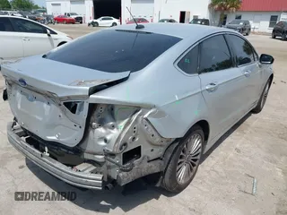2014 Ford Fusion Titanium with VIN 3FA6P0K99ER358244, listed as a IAAI auction lot 42085703 with 194,626 mi miles. Bid and sale history available at carsss.com. Image 4.