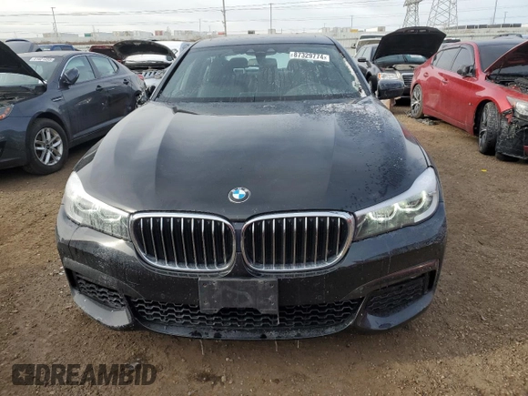 2019 BMW 7 Series 740i xDrive z VIN WBA7E4C50KGV28241, wystawiony jako Copart lot #87329774 z przebiegiem Nie podano mil oraz Szkoda całkowita • Salvage title. Historia ofert i sprzedaży dostępna na DreamBid. Obrazek 5.