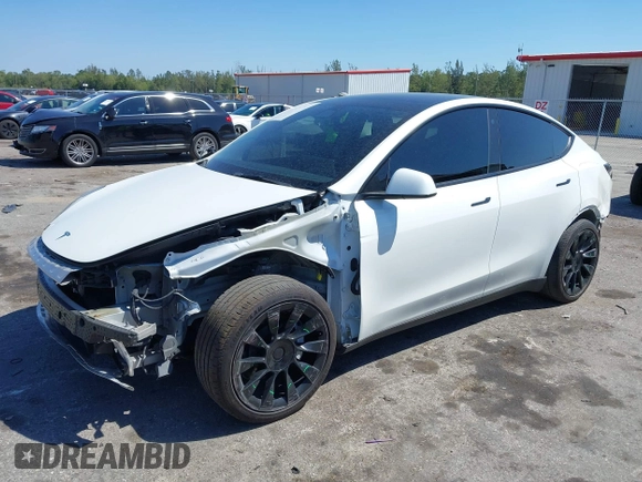 2022 Tesla Model Y Long Range with VIN 7SAYGAEE8NF431786, listed as a IAAI auction lot 41750353 with 67,846 mi miles and . Bid and sale history available at carsss.com. Image 2.