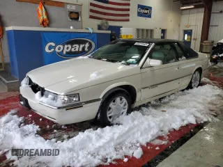 1999 Cadillac Eldorado z VIN 1G6EL12Y1XU610002, wystawiony jako Copart lot #88324855 z przebiegiem 100 740 mil mil oraz Szkoda całkowita • Salvage title. Historia ofert i sprzedaży dostępna na DreamBid. Obrazek 1.