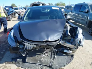 2022 Tesla Model 3 with VIN 5YJ3E1EA3NF165054, listed as a IAAI auction lot 41805729 with 225,773 mi miles. Bid and sale history available at carsss.com. Image 11.