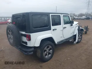 2017 Jeep Wrangler Unlimited 75th Anniversary z VIN 1C4BJWEG9HL684152, wystawiony jako IAAI lot #41880074 z przebiegiem 91 847 mil mil oraz . Historia ofert i sprzedaży dostępna na DreamBid. Obrazek 4.