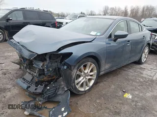2014 Mazda 6 i Touring with VIN JM1GJ1T53E1112768, listed as a IAAI auction lot 41727440 with 166,081 mi miles and . Bid and sale history available at DreamBid. Image 2.
