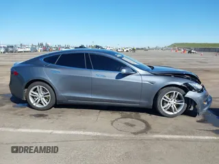 2014 Tesla Model S 60 with VIN 5YJSA1S10EFP32851, listed as a IAAI auction lot 41730746 with 91,657 mi miles and . Bid and sale history available at DreamBid. Image 13.