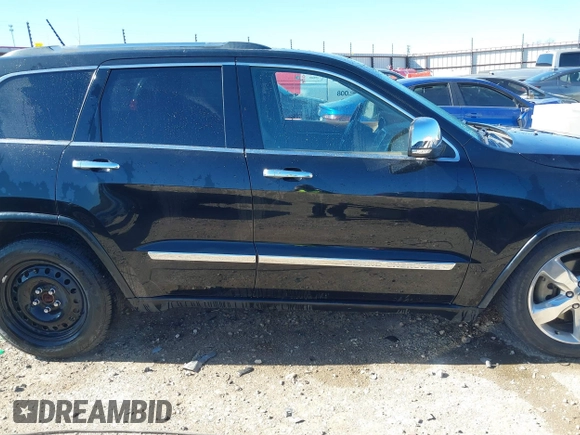 2013 Jeep Grand Cherokee Overland with VIN 1C4RJFCT1DC654653, listed as a IAAI auction lot 41826619 with 124,283 mi miles. Bid and sale history available at carsss.com. Image 14.