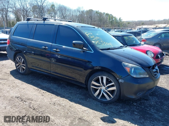2009 Honda Odyssey EX-L with VIN 5FNRL38759B055396, listed as a IAAI auction lot 41863703 with 999,999 mi miles. Bid and sale history available at carsss.com. Image 1.