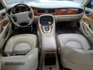 1999 Jaguar XJ with VIN SAJKD6041XC876928, listed as a Copart auction lot 60038405 with 63,917 mi miles and Clean title. Bid and sale history available at DreamBid. Image 8.