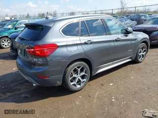 2016 BMW X1 xDrive28i with VIN WBXHT3C35GP886094, listed as a IAAI auction lot 42009639 with 61,739 mi miles. Bid and sale history available at carsss.com. Image 4.