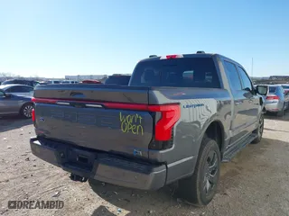 2023 Ford F-150 Lightning Pro with VIN 1FTVW1EL8PWG06781, listed as a IAAI auction lot 41861926 with 27,051 mi miles. Bid and sale history available at carsss.com. Image 4.