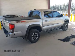 2018 Toyota Tacoma SR with VIN 3TMCZ5ANXJM146284, listed as a IAAI auction lot 42041525 with 103,143 mi miles and . Bid and sale history available at DreamBid. Image 4.