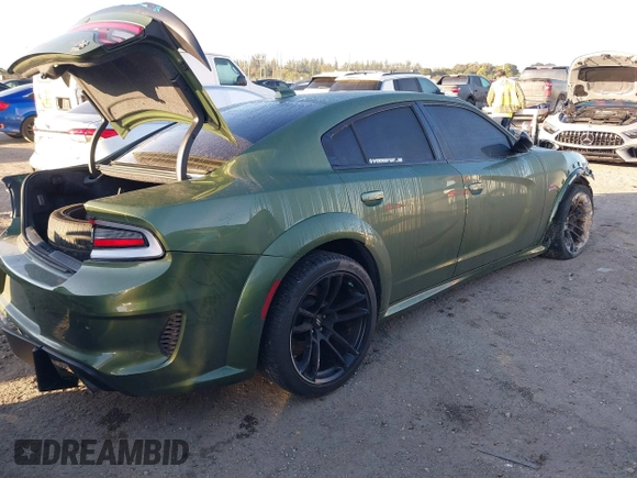 2023 Dodge Charger Scat Pack Widebody with VIN 2C3CDXGJXPH655916, listed as a IAAI auction lot 41439932 with 16,128 mi miles and . Bid and sale history available at carsss.com. Image 4.